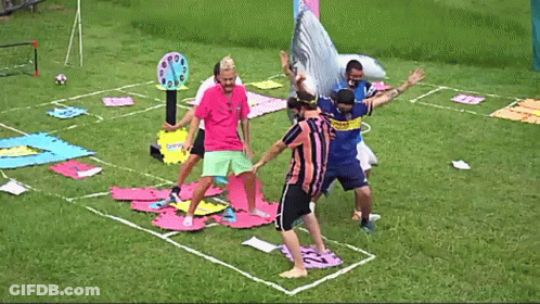 A Man Wearing A Jersey That Says ' Boca Juniors ' On It Stands On A Soccer Field GIF