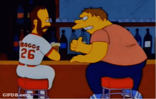 A Man Wearing A Jersey That Says Boggs 26 Is Sitting At A Bar GIF