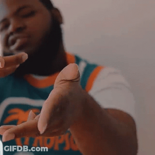 A Man Wearing A Jersey That Says Miami GIF