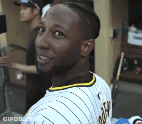 A Man Wearing A Jersey That Says ' Tigers ' On The Back GIF