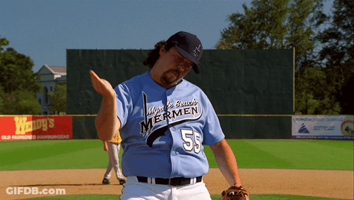 A Man Wearing A Jersey That Says Windy Beach Mermen On It GIF
