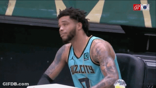 A Man Wearing A Jersey That Says Wiz City GIF
