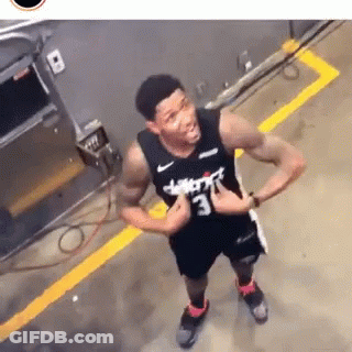 A Man Wearing A Jersey That Says Wizards On It GIF