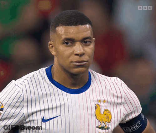 A Man Wearing A Jersey With A Rooster On It And A Bbc Logo GIF
