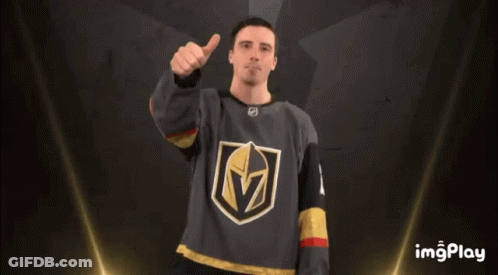 A Man Wearing A Jersey With The Letter M On It Gives A Thumbs Up GIF
