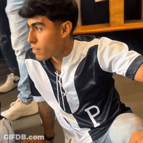 A Man Wearing A Jersey With The Letter P On The Front GIF