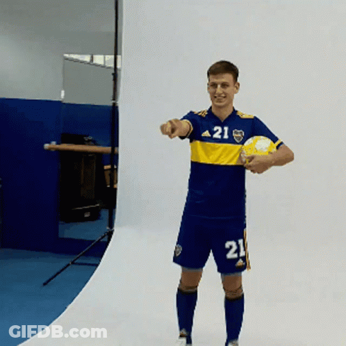 A Man Wearing A Jersey With The Number 21 On It Holds A Soccer Ball GIF
