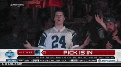 A Man Wearing A Jersey With The Number 24 On It Stands In Front Of A Screen That Says Pick Is In GIF