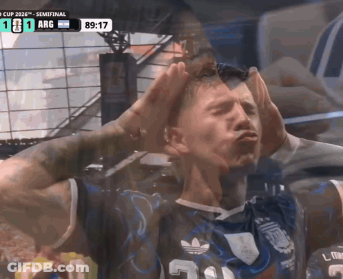 A Man Wearing A Jersey With The Number 3 On It Holds His Hands To His Head GIF