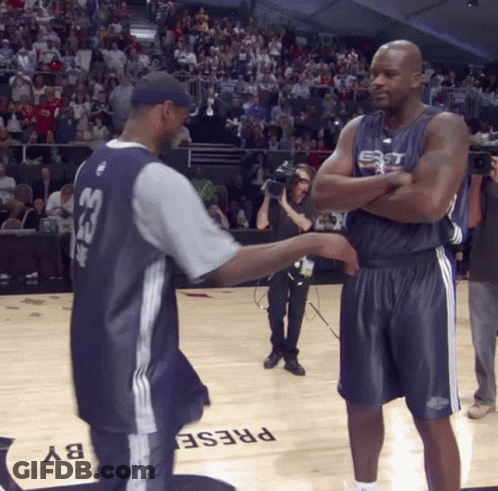 A Man Wearing A Jersey With The Number 33 On It Talks To Another Man GIF