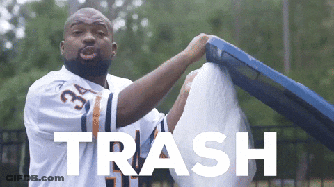 A Man Wearing A Jersey With The Number 34 On It Is Holding A Trash Can GIF