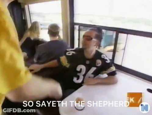 A Man Wearing A Jersey With The Number 34 Sitting At A Table GIF