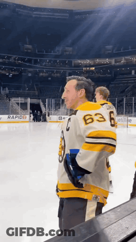 A Man Wearing A Jersey With The Number 63 On The Back GIF