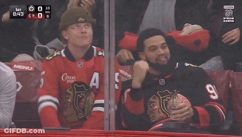 A Man Wearing A Jersey With The Number 98 On It Laughs GIF