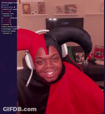 A Man Wearing A Jester Hat And Headphones Is Smiling In Front Of A Screen That Says ' Across The Seat ' GIF