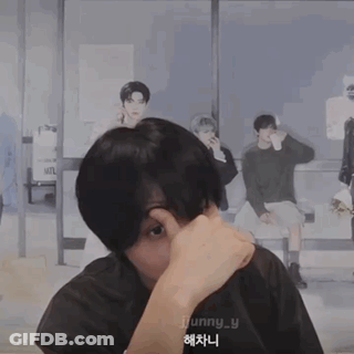 A Man Wearing A Jjunny_y Shirt Covering His Nose GIF