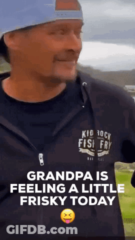 A Man Wearing A Kid Rock Fish Fry Shirt Is Making A Funny Face GIF