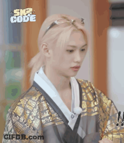 A Man Wearing A Kimono And Sunglasses With The Word Ska Code On The Bottom Right GIF