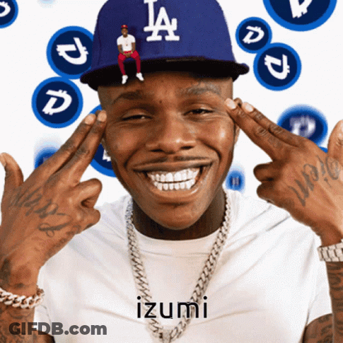 A Man Wearing A La Dodgers Hat Is Smiling With His Hands On His Forehead GIF