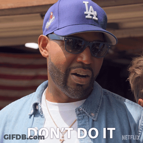 A Man Wearing A La Hat And Sunglasses Says " Dont Do It " GIF