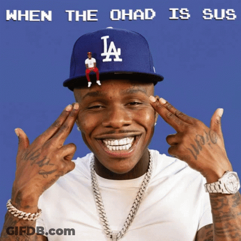 A Man Wearing A La Hat With A Tiny Man Sitting On It GIF