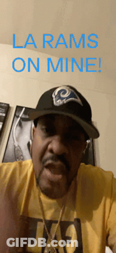 A Man Wearing A La Rams Hat And A Yellow T-Shirt Says La Rams On Mine GIF