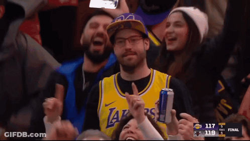 A Man Wearing A Lakers Jersey Holds A Can GIF
