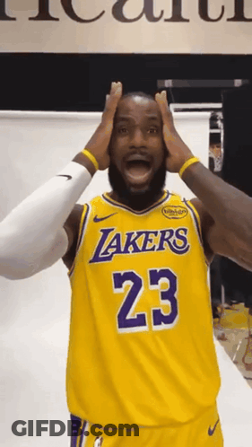 A Man Wearing A Lakers Jersey With The Number 23 GIF
