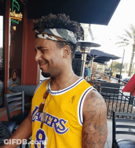 A Man Wearing A Lakers Jersey With The Number 8 GIF