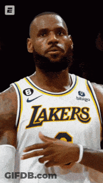 A Man Wearing A Lakers Jersey With The Number 8 On It GIF