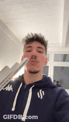 A Man Wearing A League Of Legends Hoodie GIF