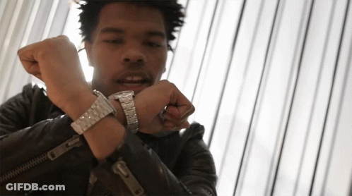 A Man Wearing A Leather Jacket And A Silver Watch On His Wrist GIF