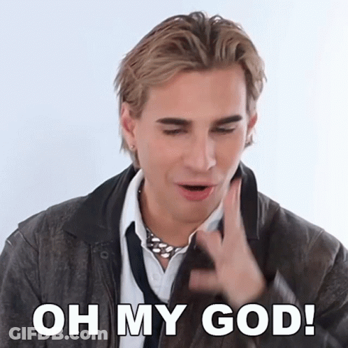 A Man Wearing A Leather Jacket And Tie Is Saying Oh My God GIF