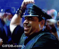 A Man Wearing A Leather Vest And A Police Hat GIF