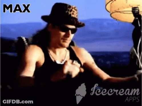 A Man Wearing A Leopard Print Hat And Sunglasses Is Sitting In Front Of An Ice Cream Advertisement GIF