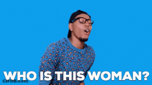 A Man Wearing A Leopard Print Shirt And Glasses Is Asking Who Is This Woman . GIF