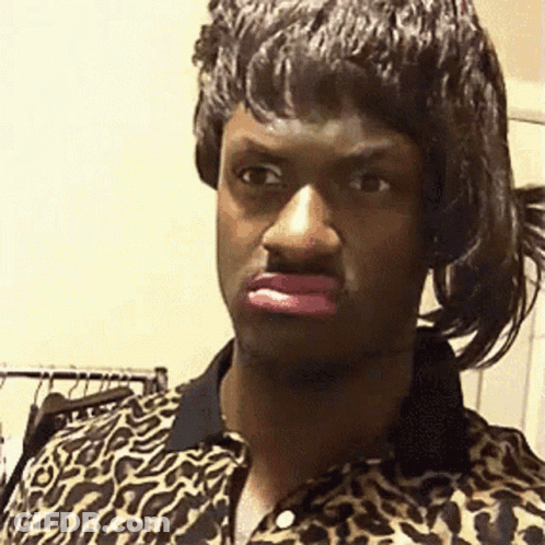 A Man Wearing A Leopard Print Shirt Has Pink Lipstick On His Lips . GIF