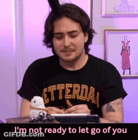 A Man Wearing A Letterda T-Shirt Is Writing On A Notepad GIF