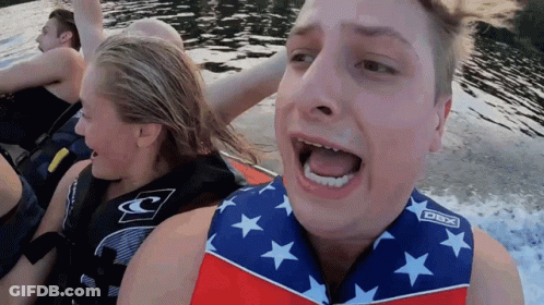A Man Wearing A Life Vest That Says Dbx On The Front GIF