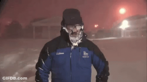 A Man Wearing A Ll Bean Jacket Stands In The Snow GIF