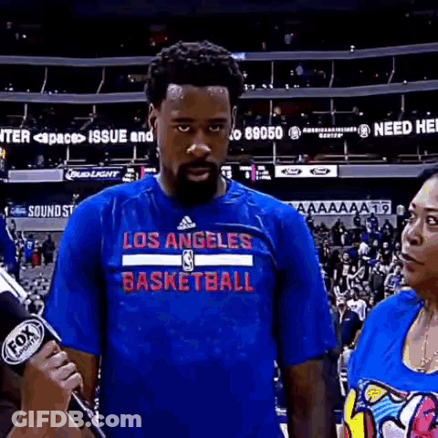 Man In Los Angeles Basketball Shirt Being Interviewed GIF