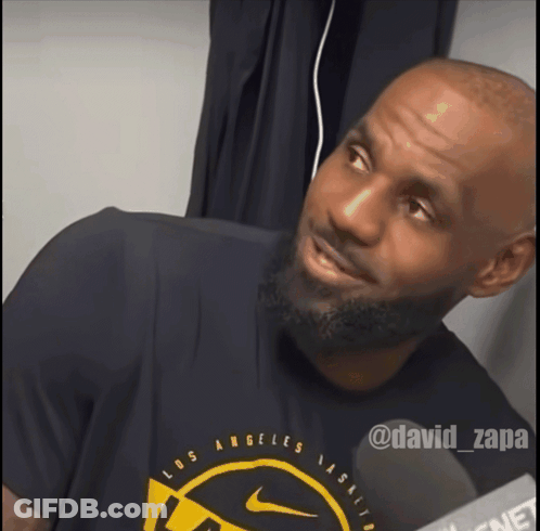 A Man Wearing A Los Angeles T-Shirt Is Smiling GIF