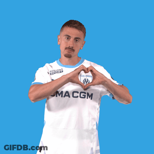 A Man Wearing A Ma Cgm Jersey Making A Heart Shape With His Hands GIF