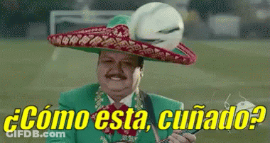 A Man Wearing A Mariachi Hat Is Holding A Soccer Ball And A Guitar . GIF