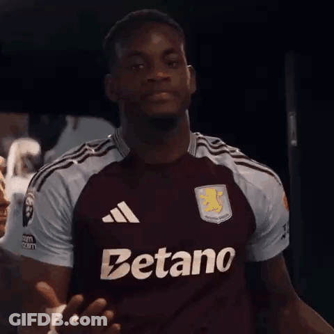A Man Wearing A Maroon Jersey That Says Betano On The Front GIF
