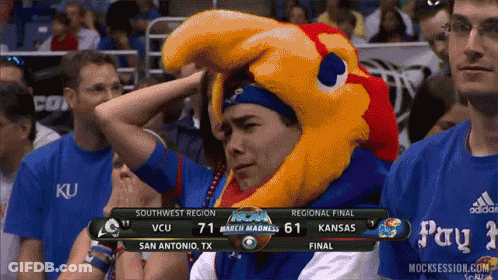 A Man Wearing A Mascot Hat Watches A Basketball Game GIF
