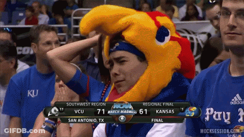 A Man Wearing A Mascot Hat Watches A Basketball Game GIF