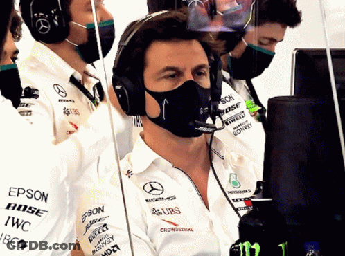 A Man Wearing A Mask And A Bose Headset GIF