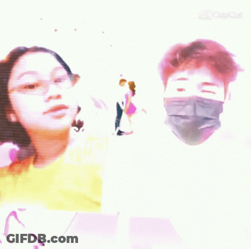 A Man Wearing A Mask And A Girl Wearing Glasses Are Standing Next To Each Other . GIF