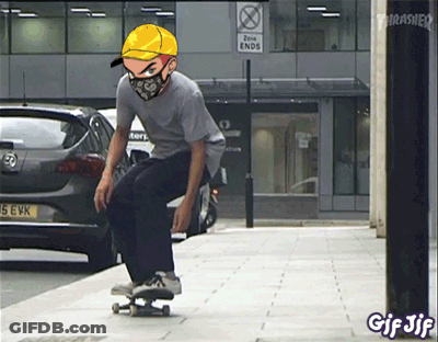A Man Wearing A Mask And A Yellow Hat Is Riding A Skateboard In Front Of A Thrasher Sign GIF